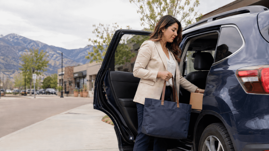 Colorado small-business owner loading work supplies into her personal vehicle before visiting a client.